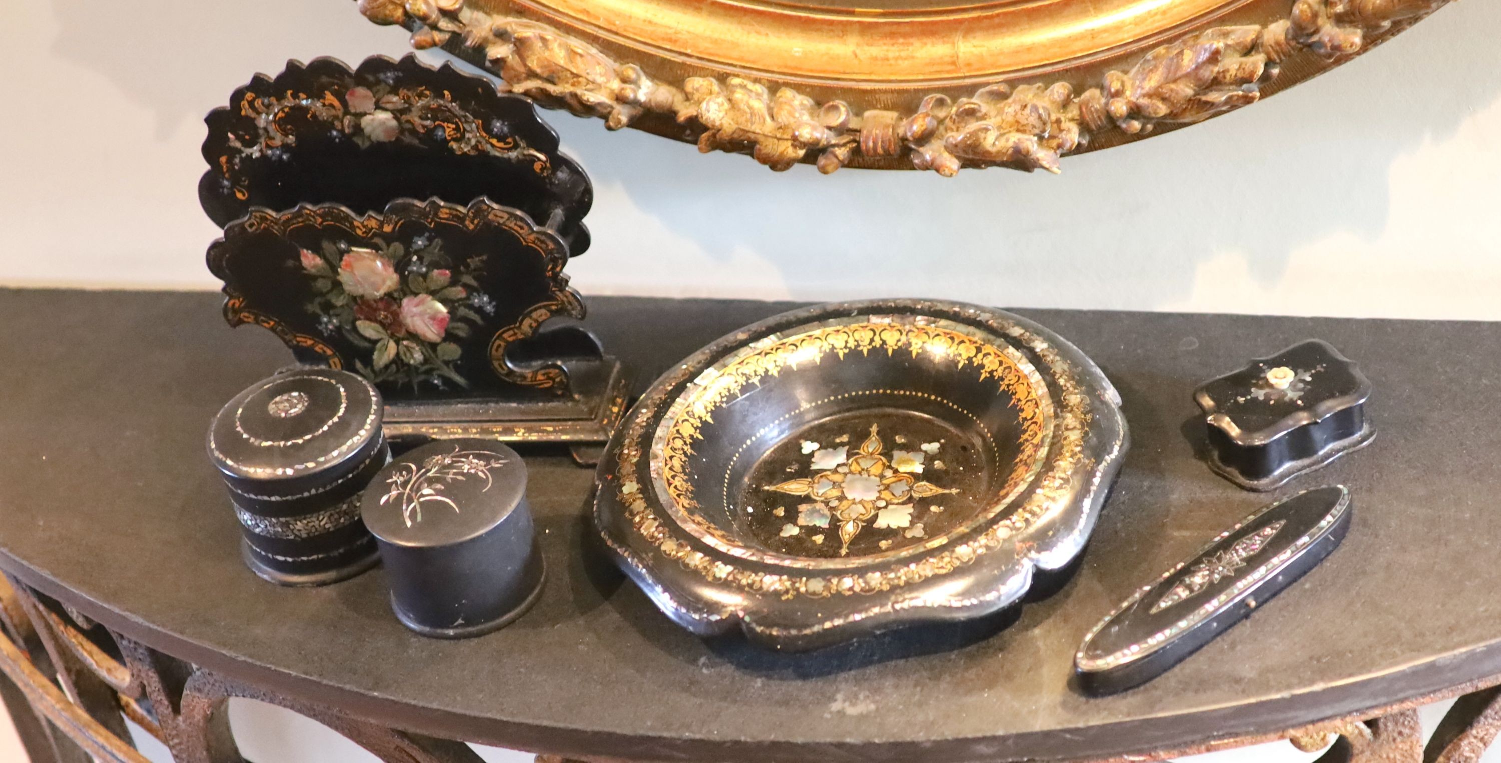 A small collection of Victorian papier mache wares comprising letter rack, bowl and three assorted boxes